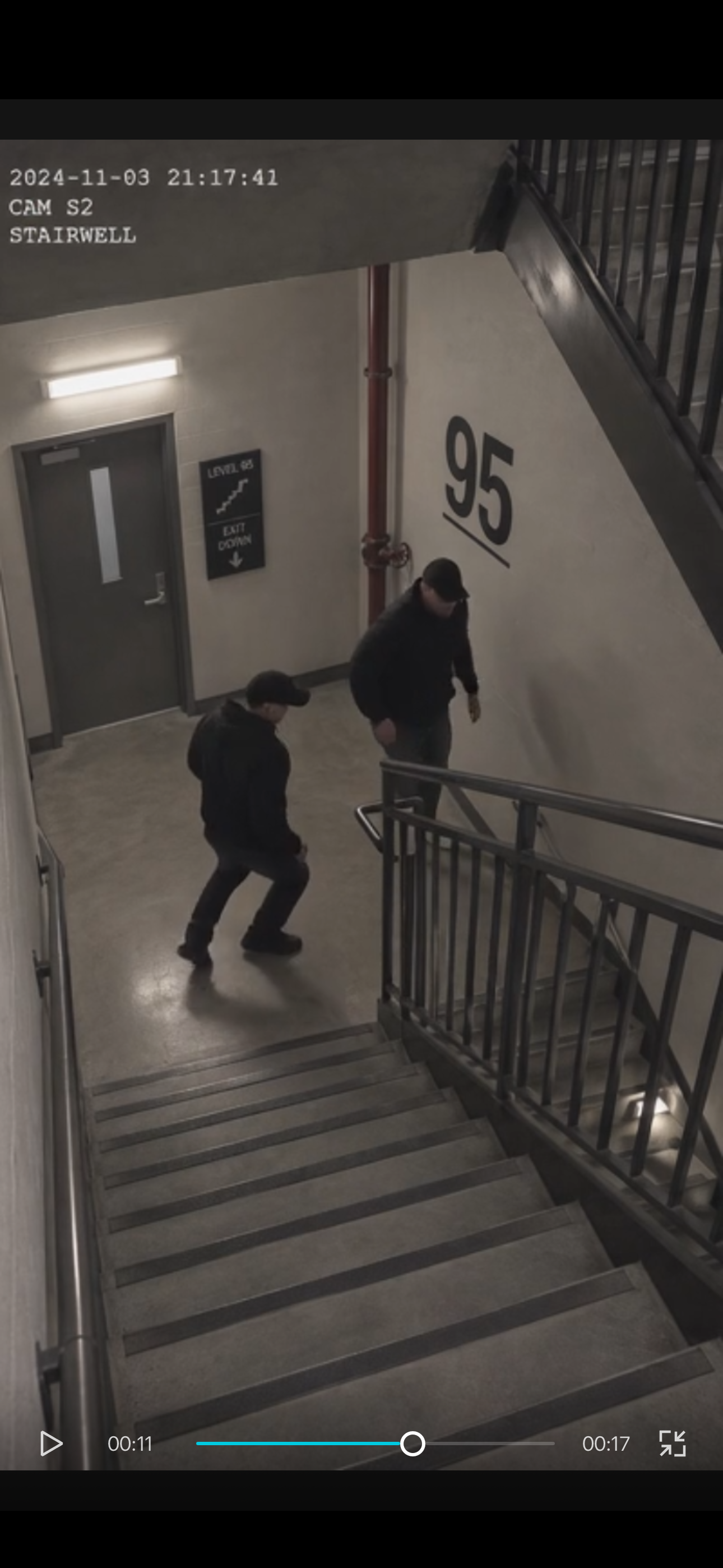 Stairwell with a large 95 marking and a smaller level sign