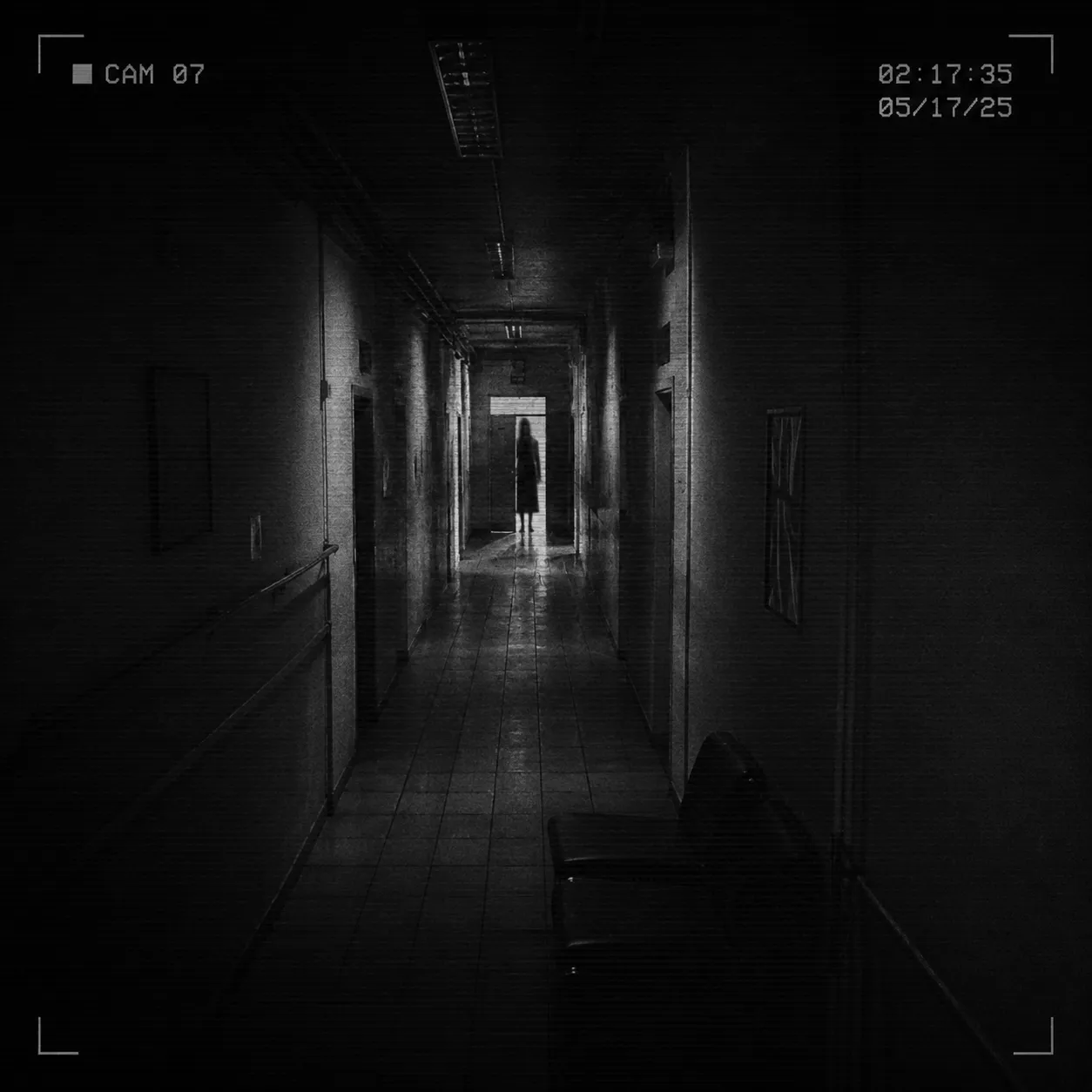 CCTV case frame showing a lone figure in a dark hallway